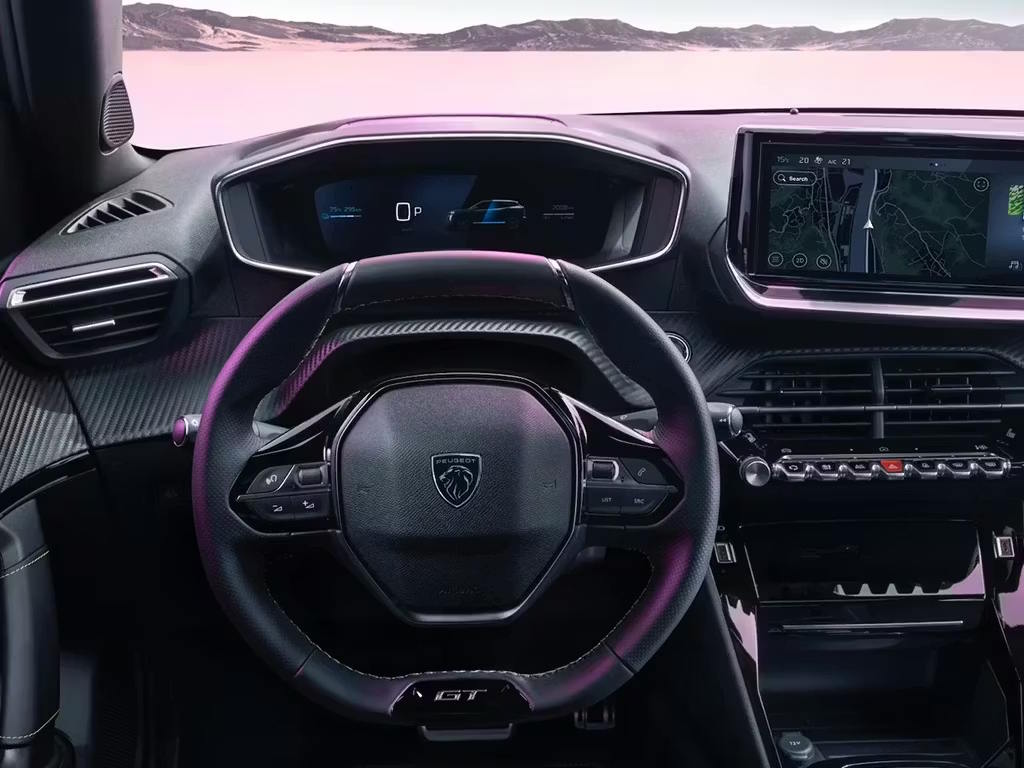 Peugeot E-2008 interior featuring the Peugeot i-Cockpit, compact steering wheel, digital driver display and touchscreen infotainment system.