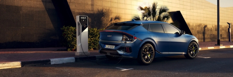 Kia EV6 GT Charging outside a modern building