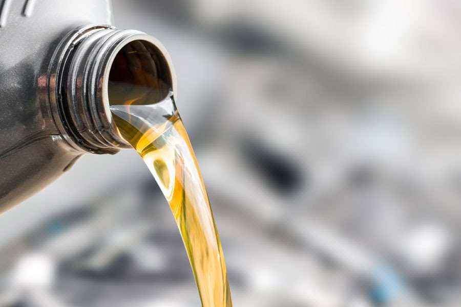 Oil being poured out of a bottle