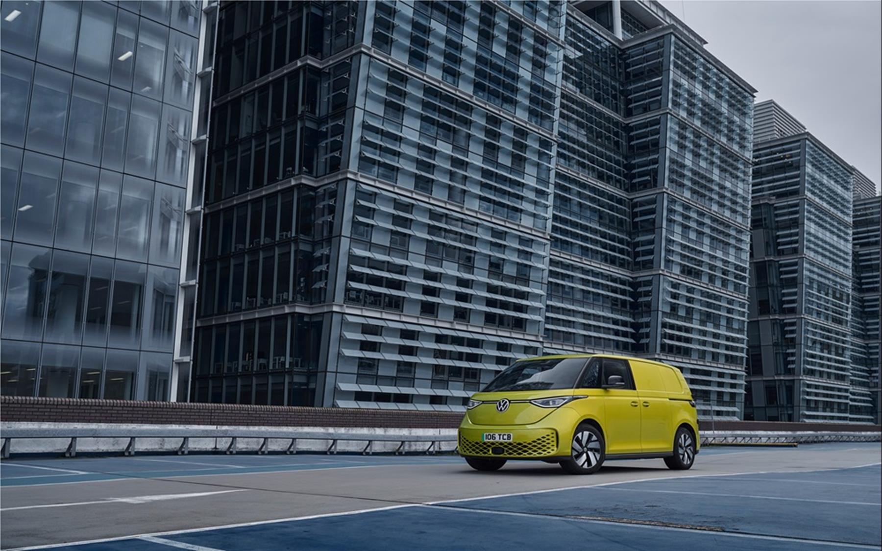 Yellow VW ID. Buzz Cargo electric van on a city rooftop car park