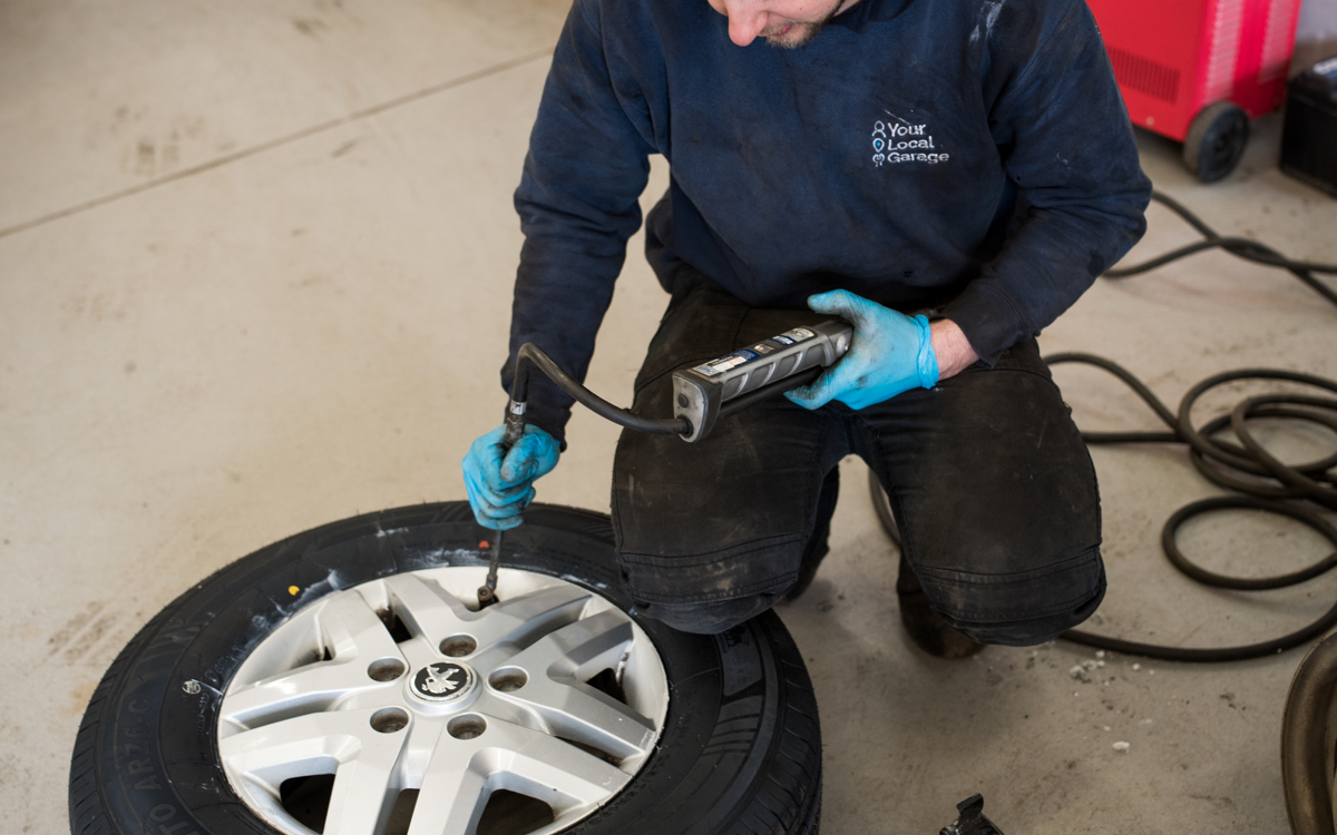 Tyre being fitted