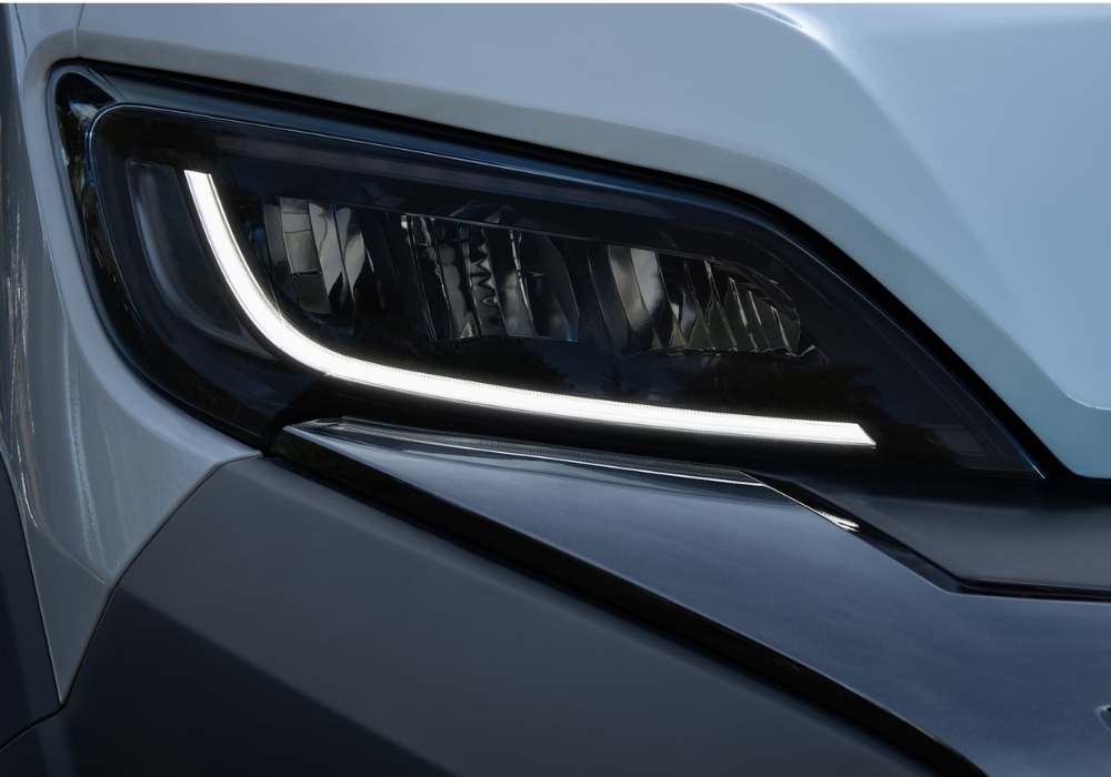 Peugeot e-Boxer front headlight detail featuring LED daytime running light design.