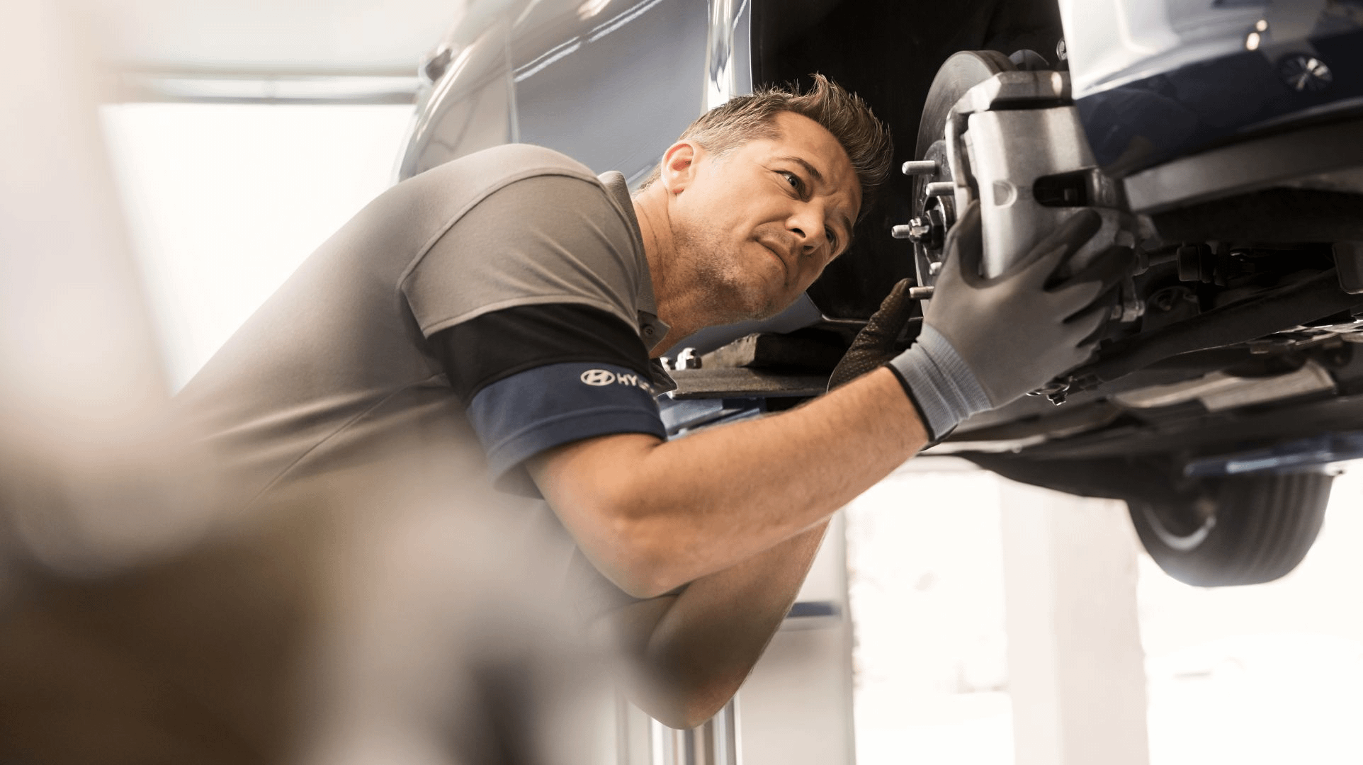 Mechanic Looking At Brake Disc