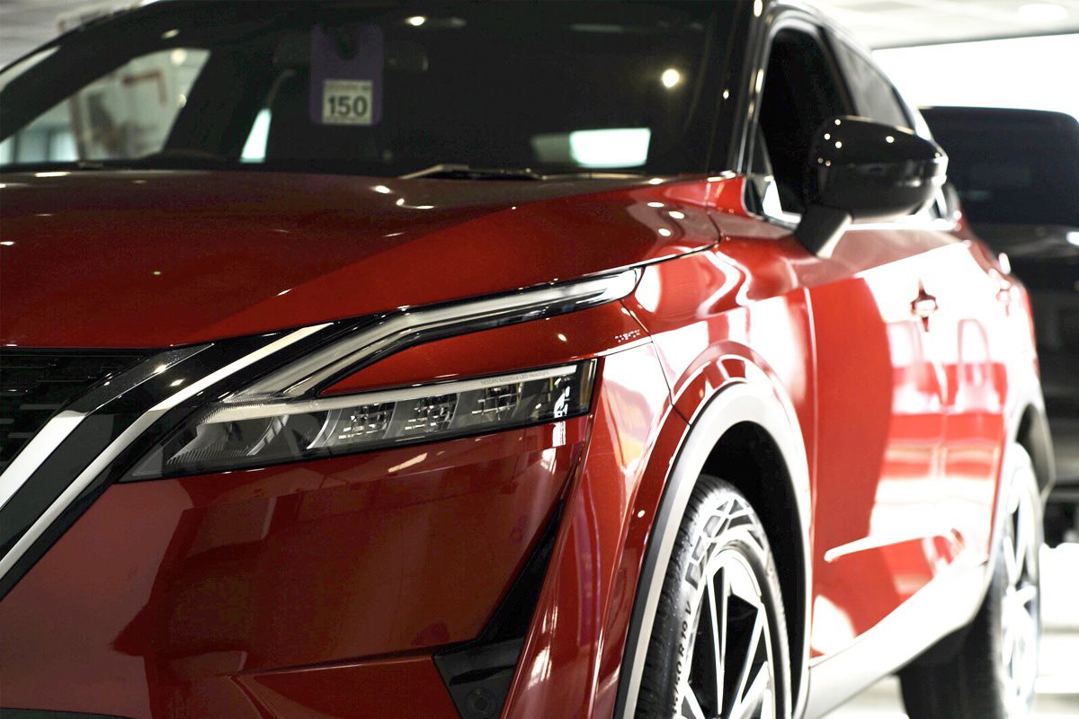 shiny red nissan car