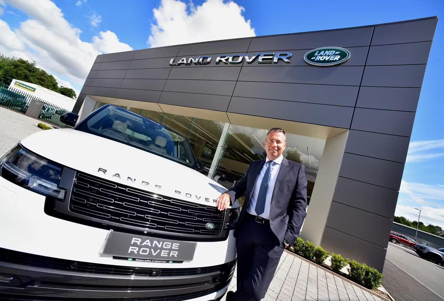 Rnage Rover in front of Land Rover Dealership