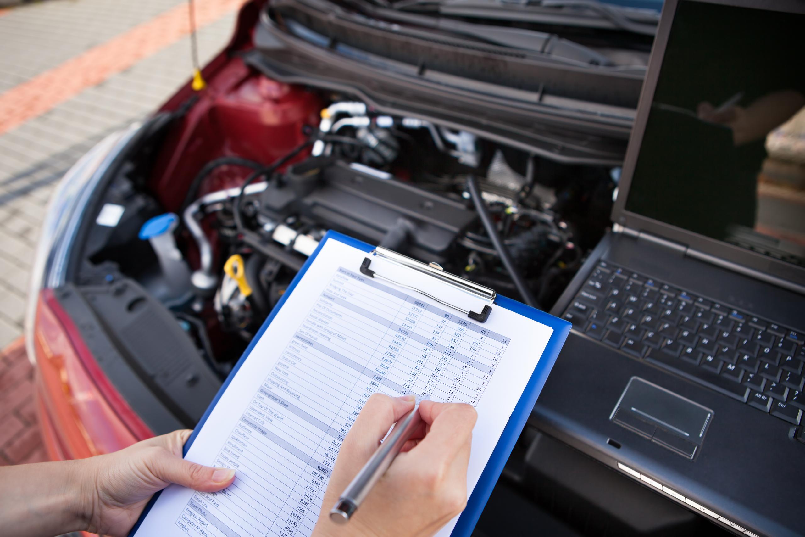 Mechanic checking vehicle