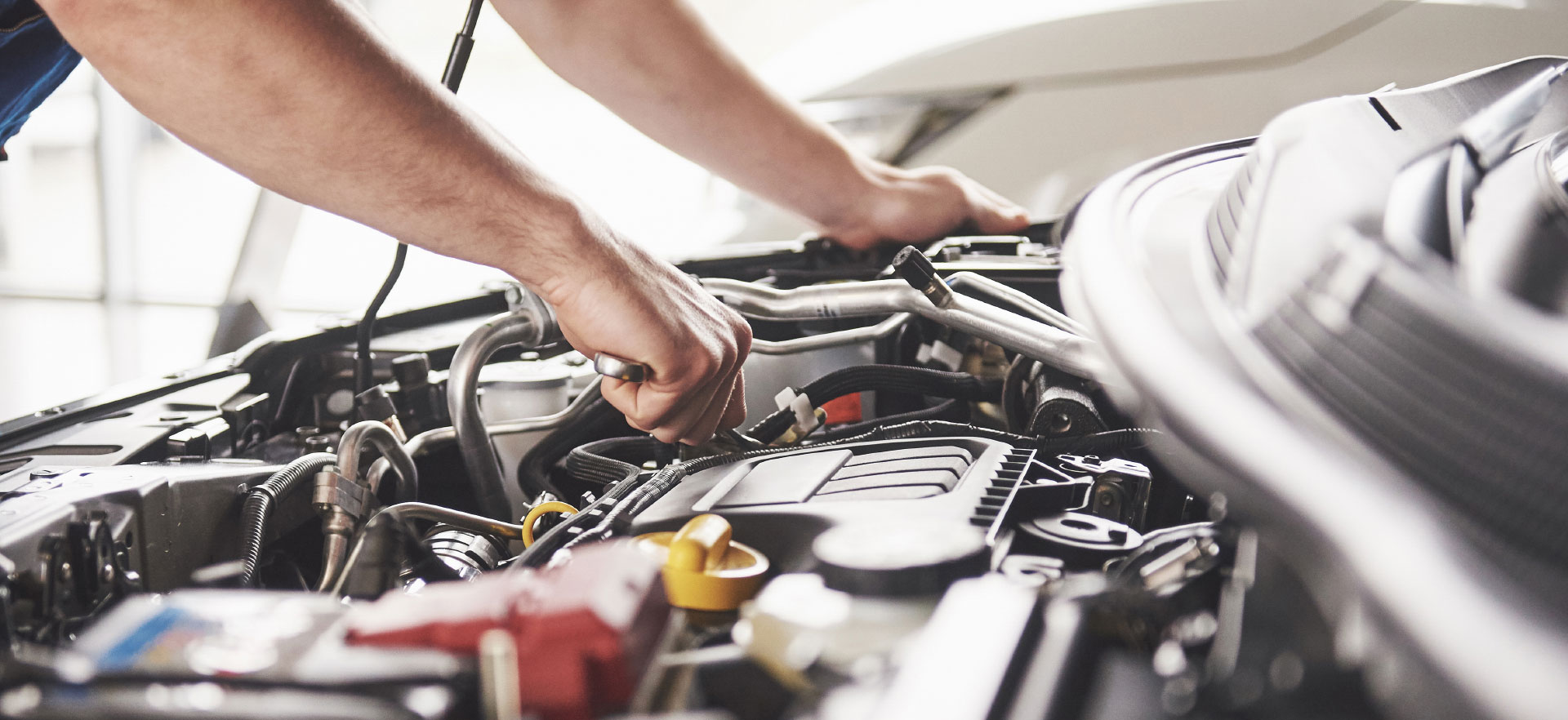 Mechanic inspecting Volkswagen Engine