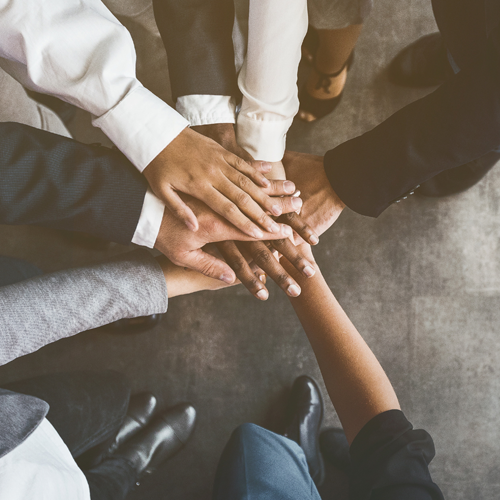 People Putting There Hands Together