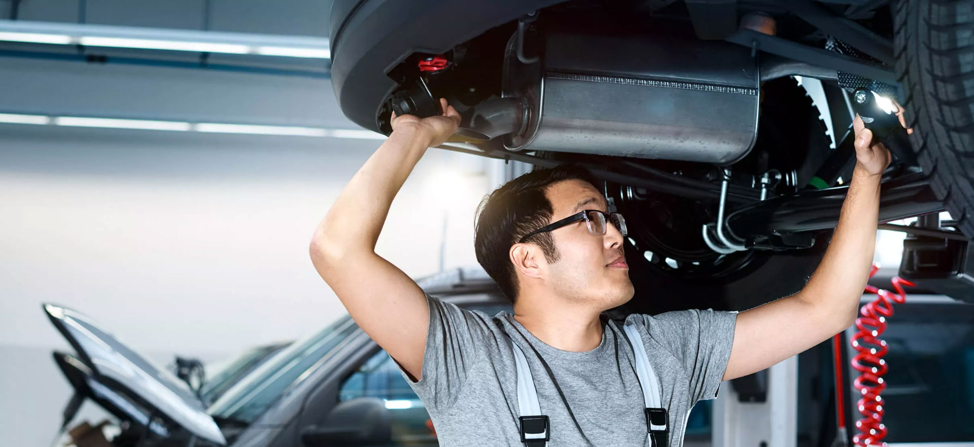 Volkswagen mechanic inspecting VW vehicle