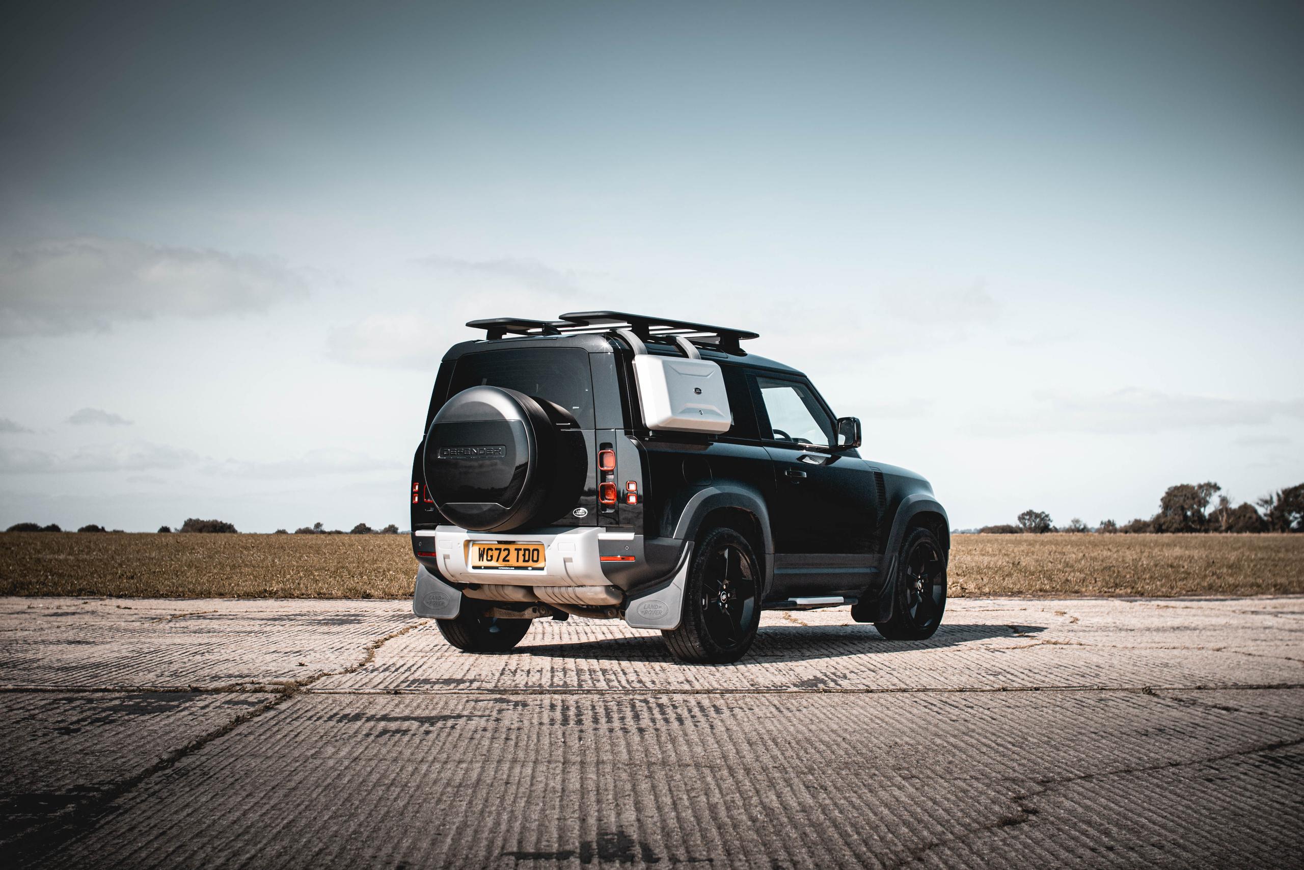 black land rover defender
