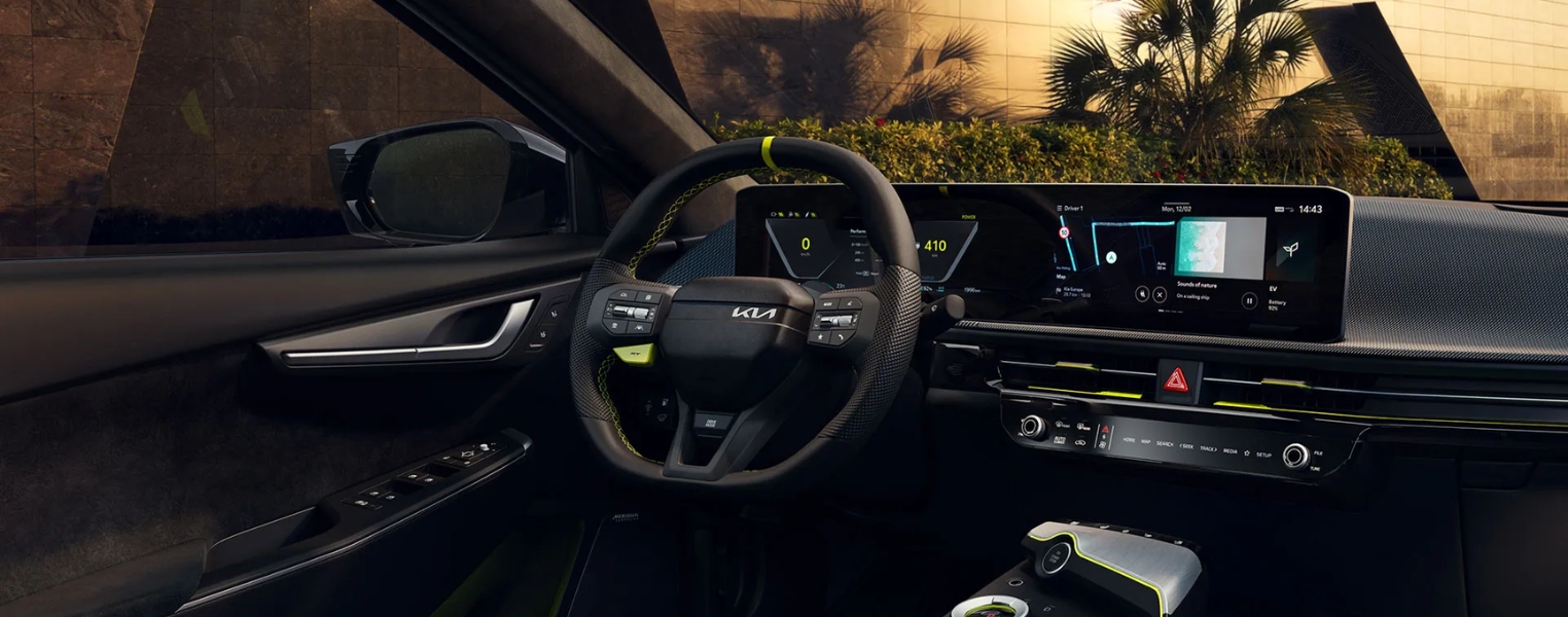 Kia EV6 GT Interior featuring the steering wheel, display screen, dashboard, and centre console.