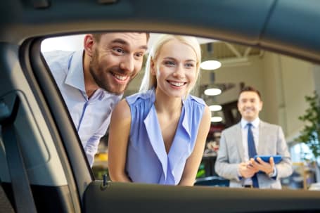 Customer looking into car