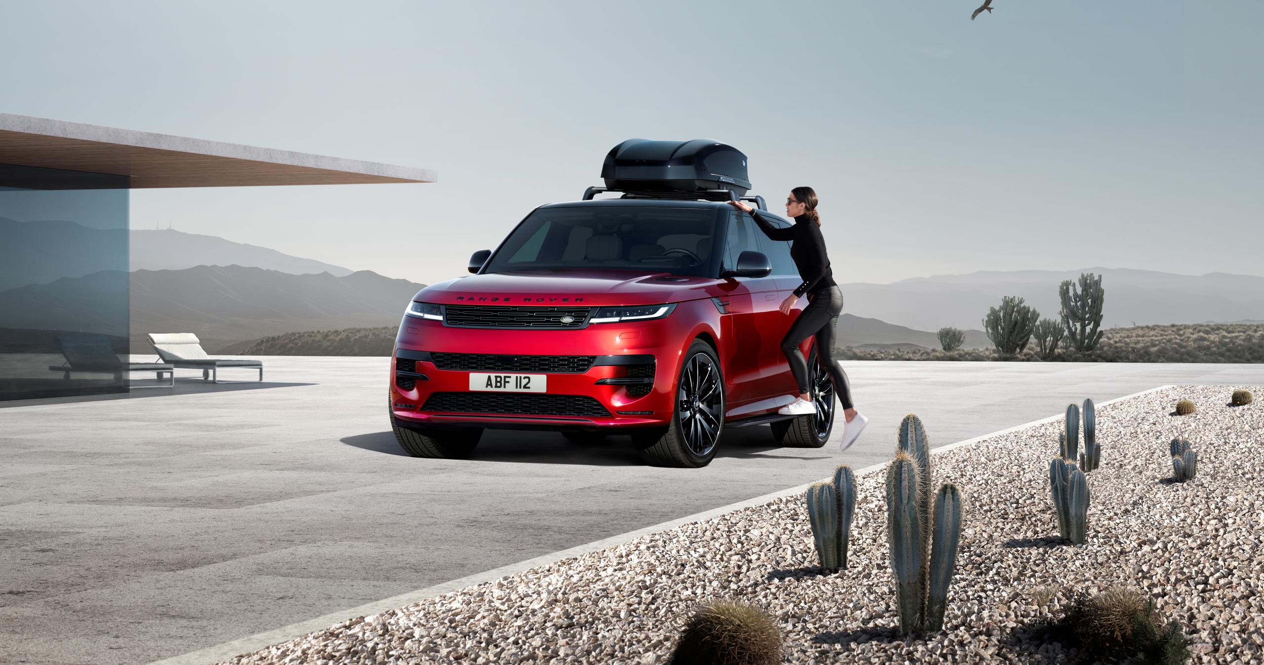 Range Rover Sport red with roof box