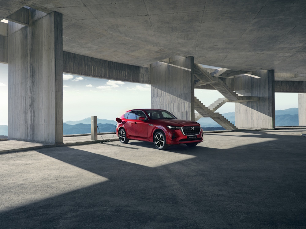 CX 60 in red being charged