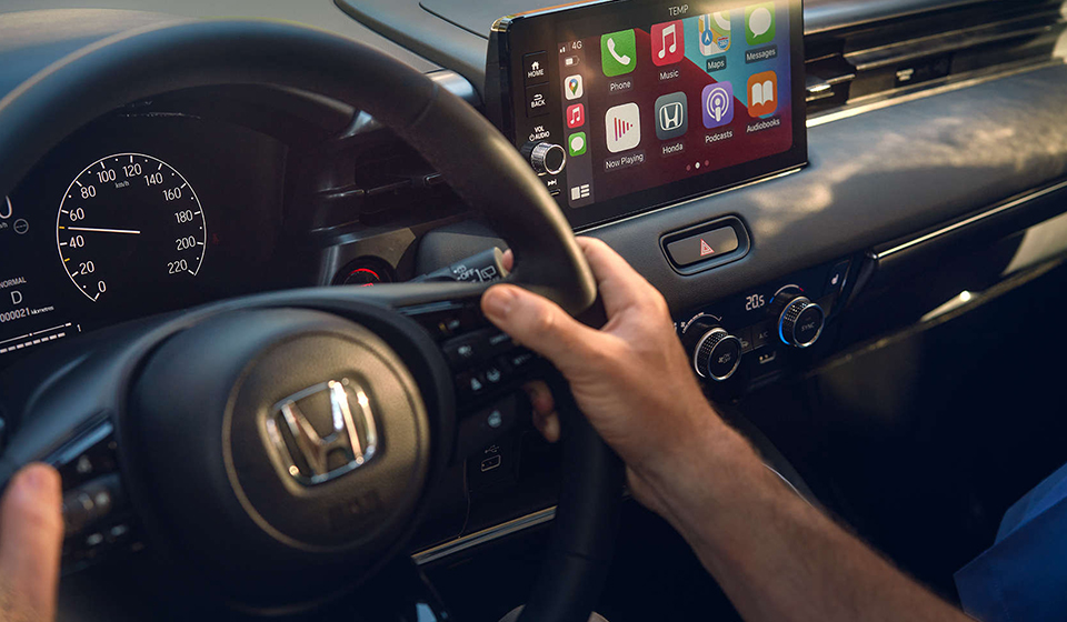 Interior dashboard of a Honda HR V, including the steering wheel and entertainment system.