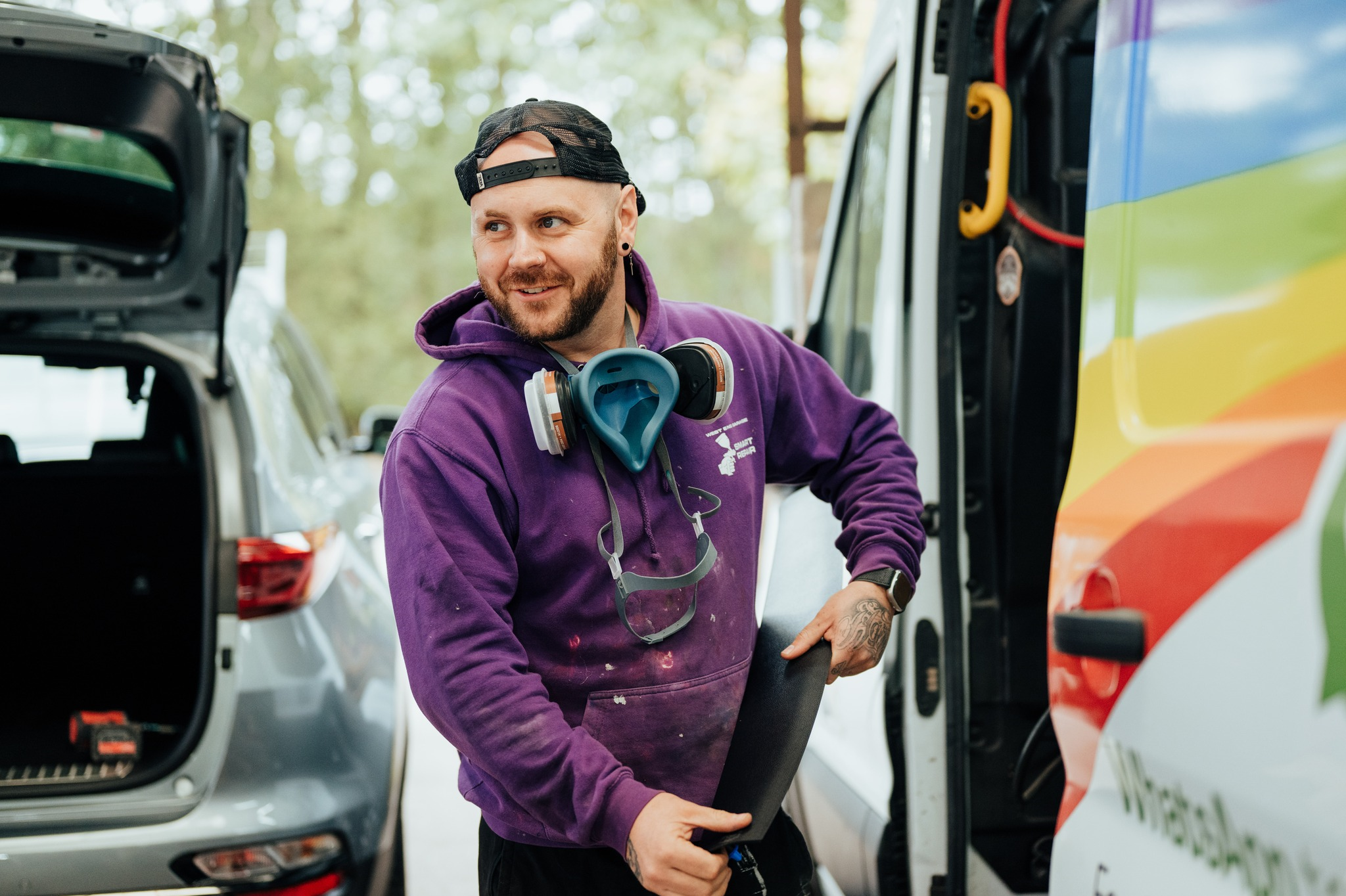 Man looking to the left and smiling