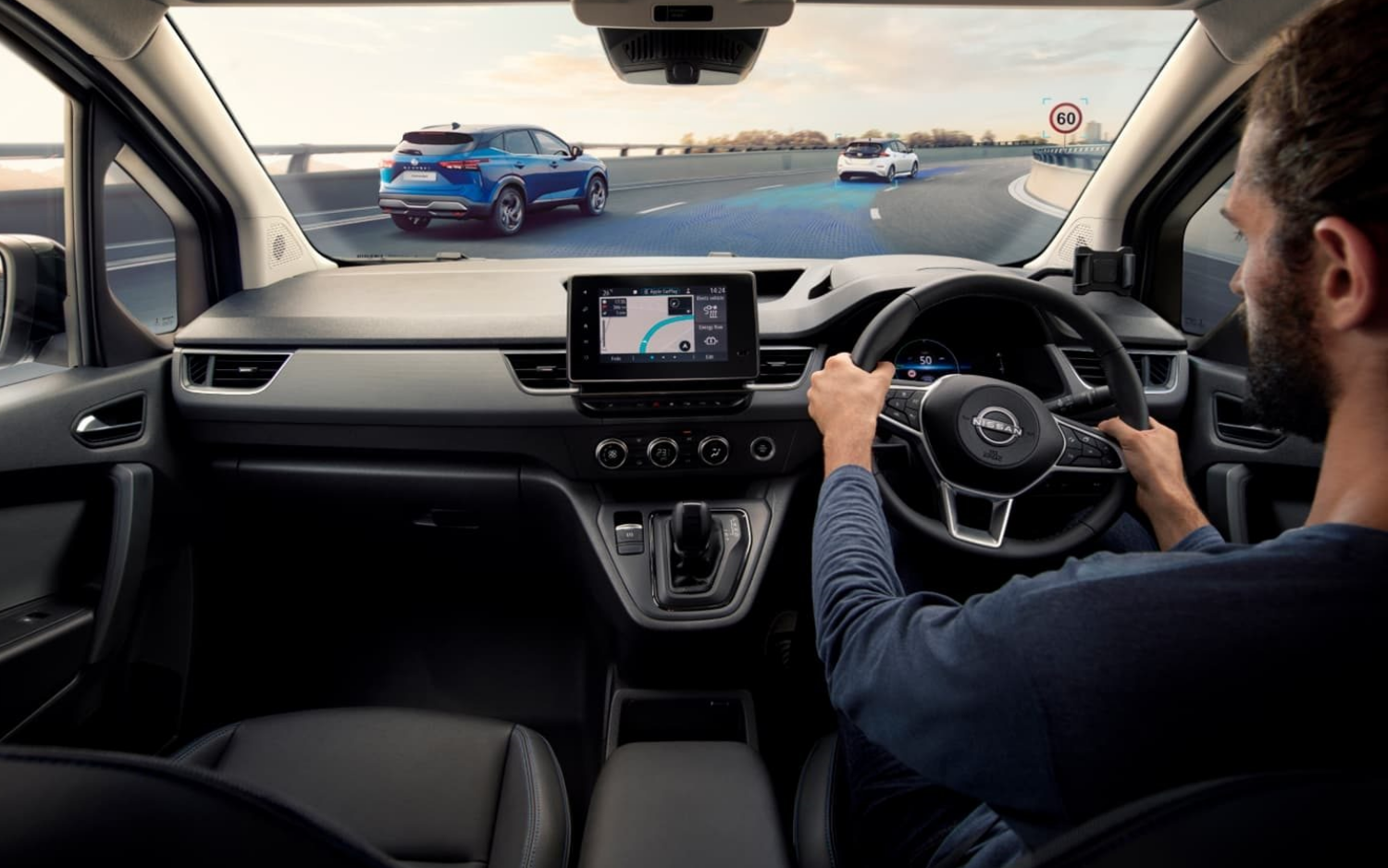 A man driving the Nissan Townstar EV