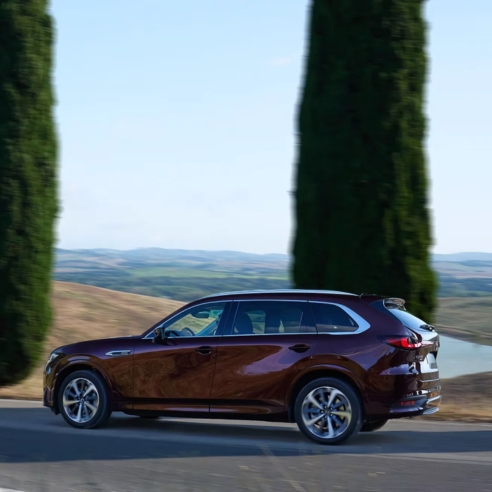 Mazda CX-80 driving shot countryside