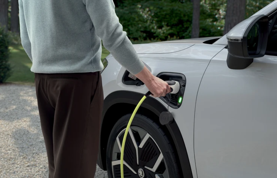 Person Charging White SKODA Kodiaq iV