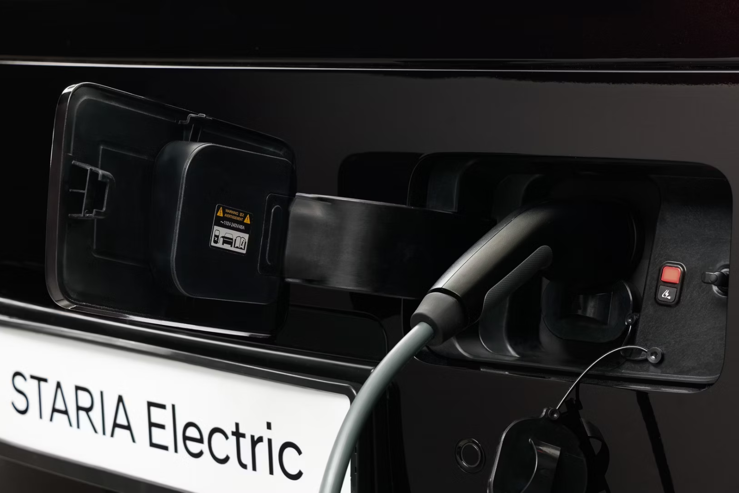 electric charger plugged into STARIA electric