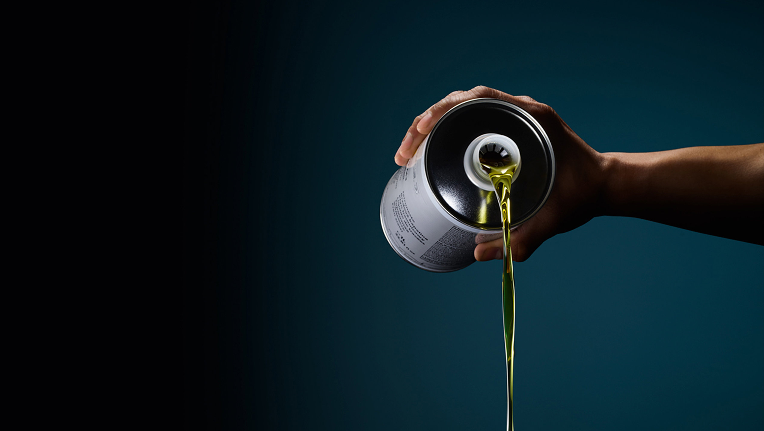 Audi oil being poured out of a can