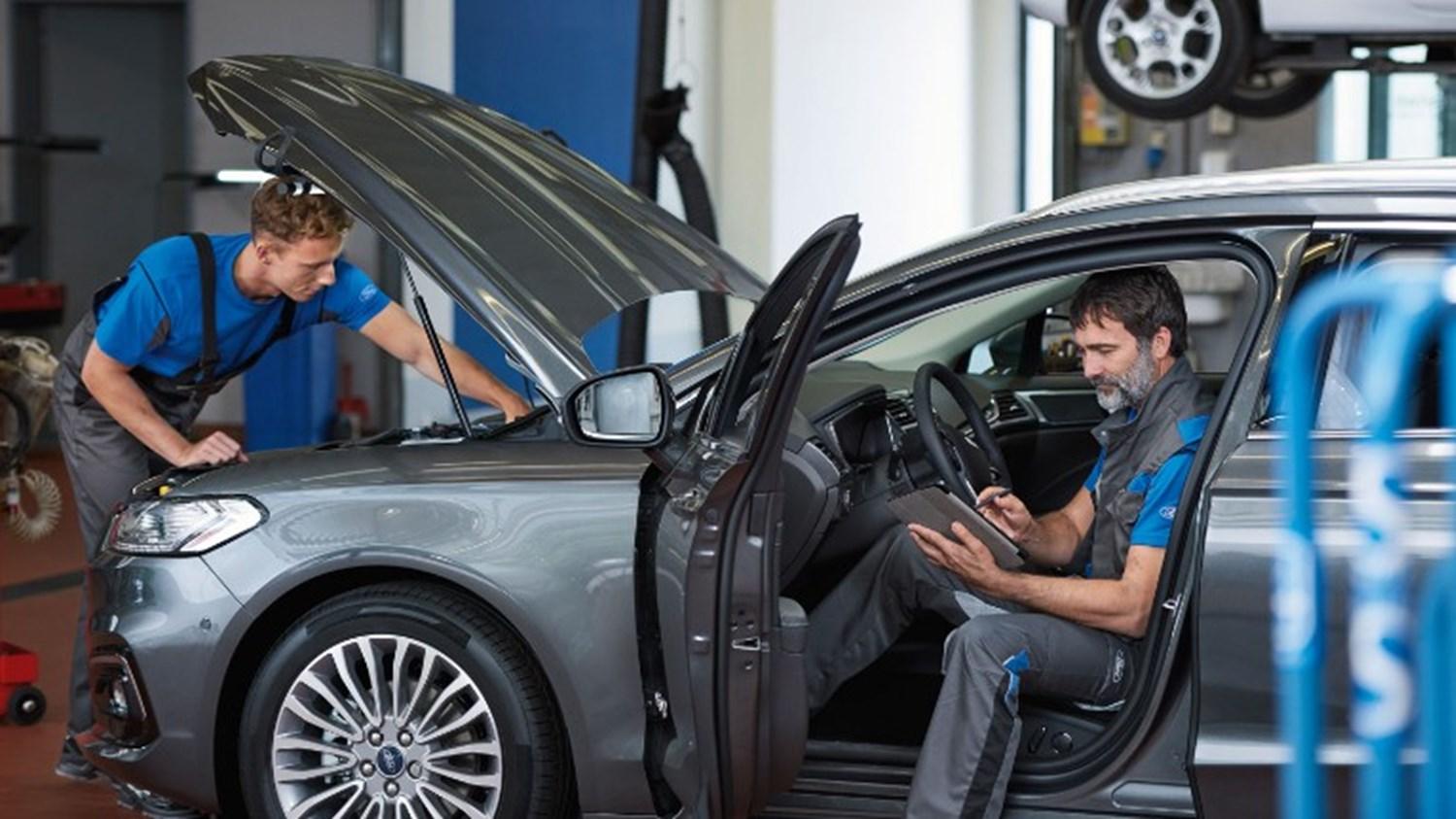 Ford Technicians Working in a Car