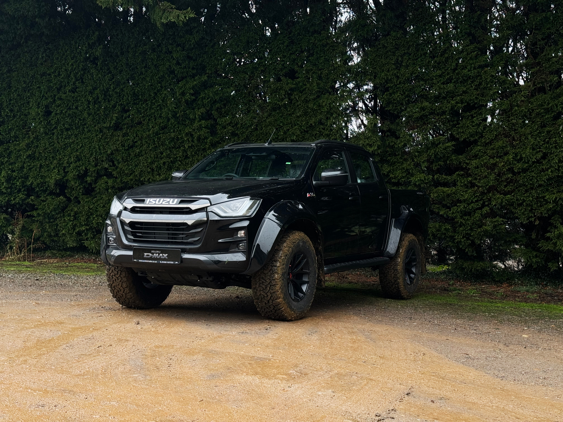 parked black isuzu at35