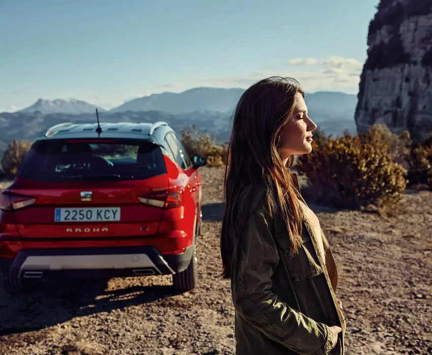 Person Stood by Red SEAT Arona