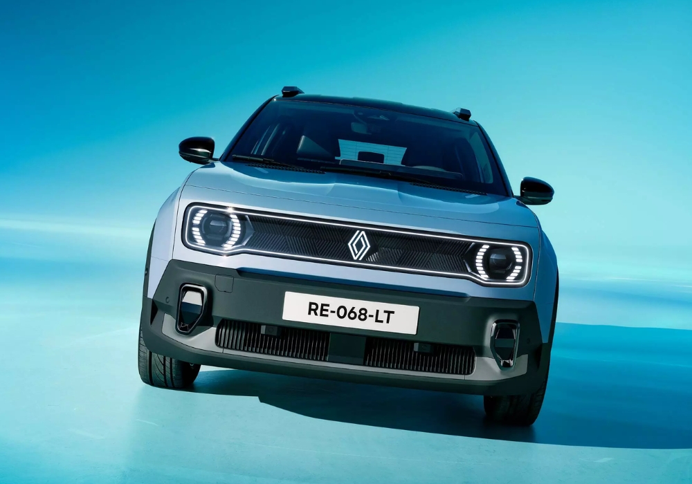 Front view of Renault 4 E-Tech electric SUV in a studio setting with blue background.