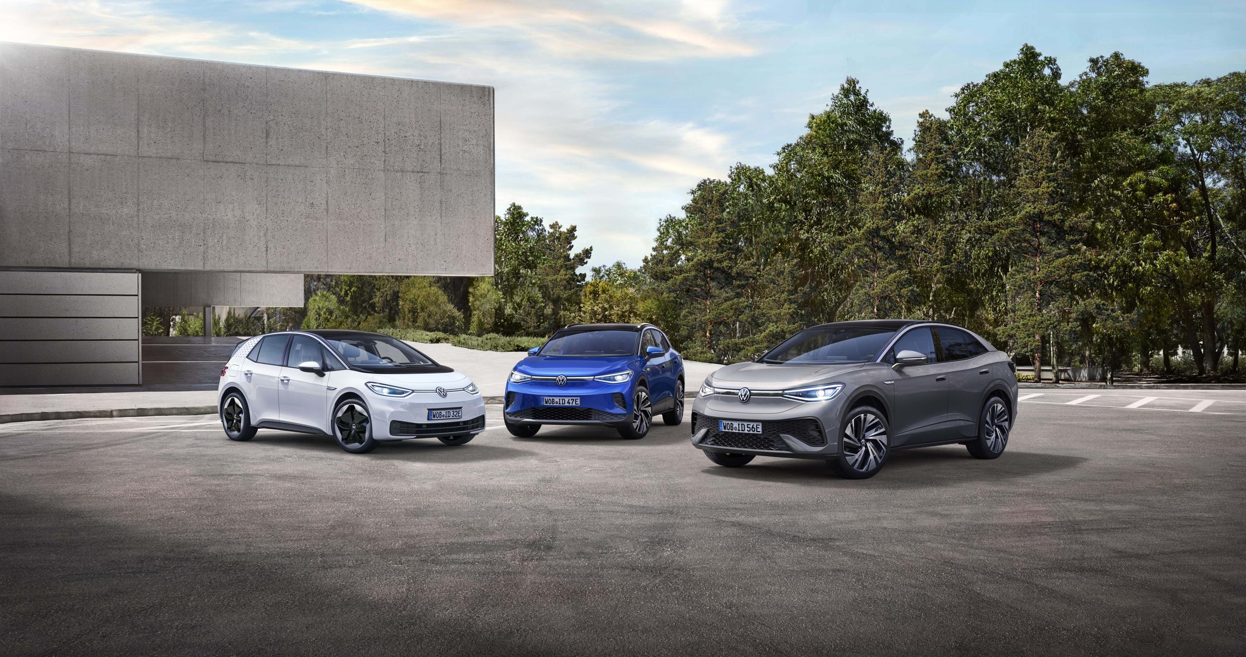 White, Blue, and Grey Volkswagen next to each other