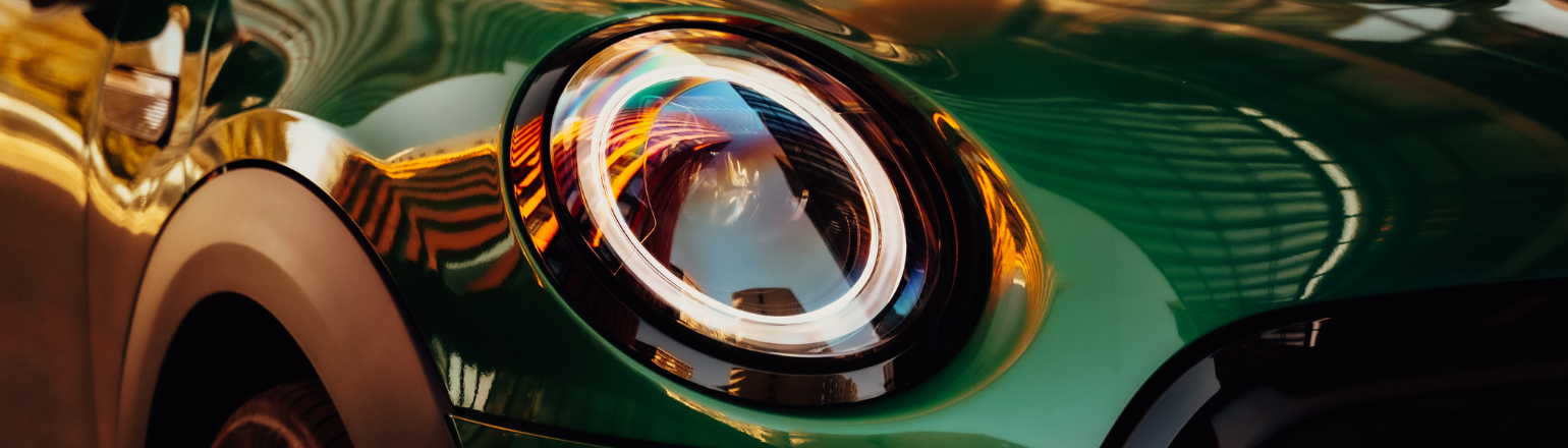 Close-up of green Mini LED headlight detail.