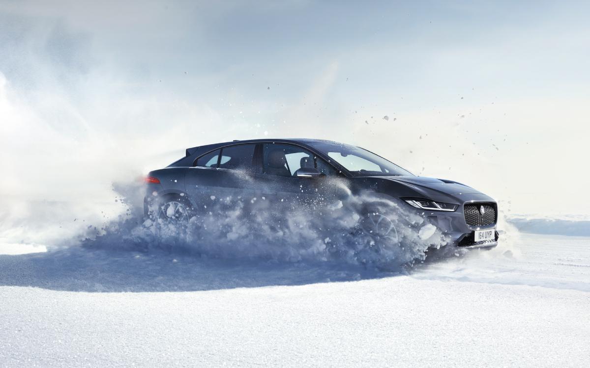 Jaguar I-Pace driving through snow