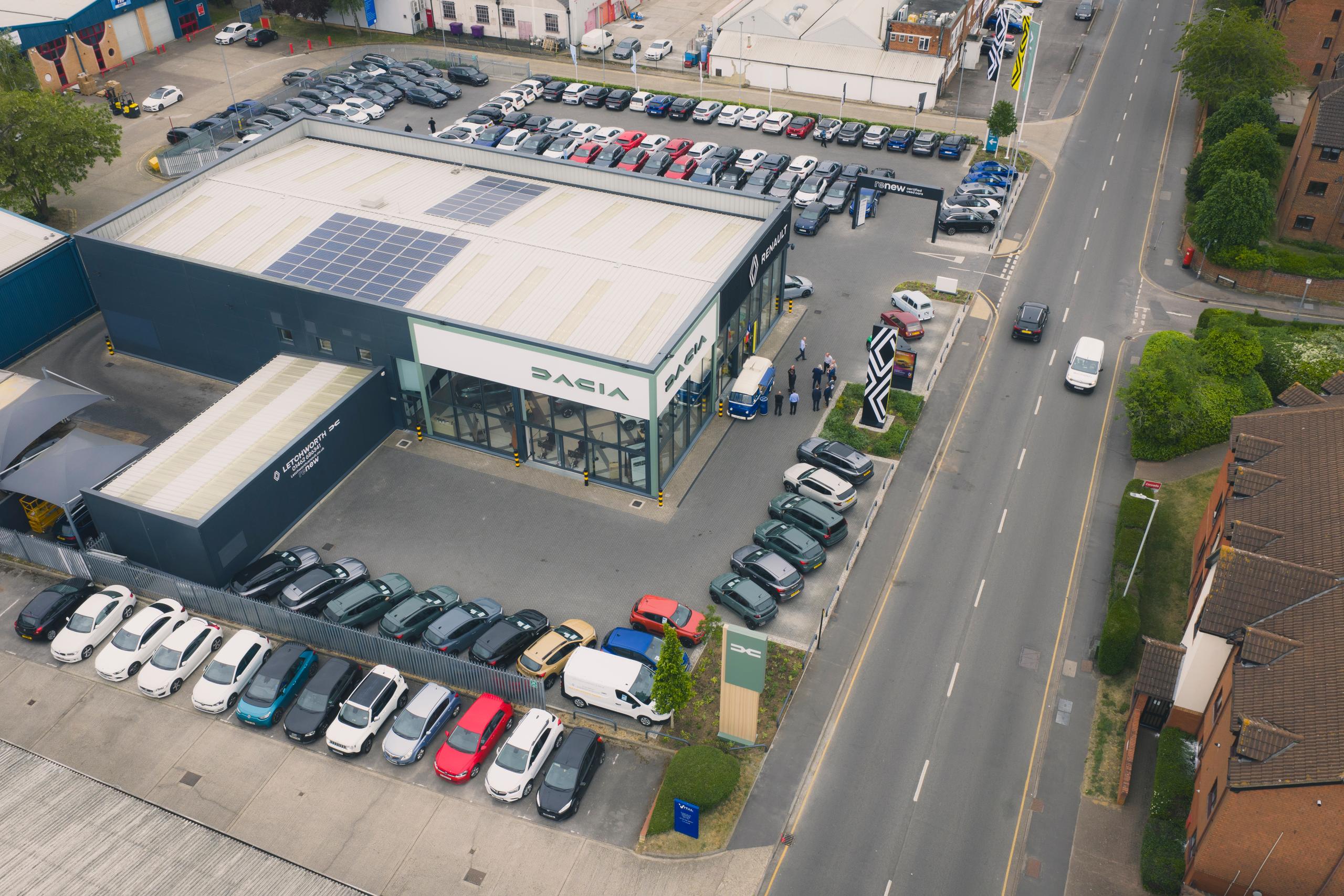 Aerial overview of Car dealership lots of colourful cars