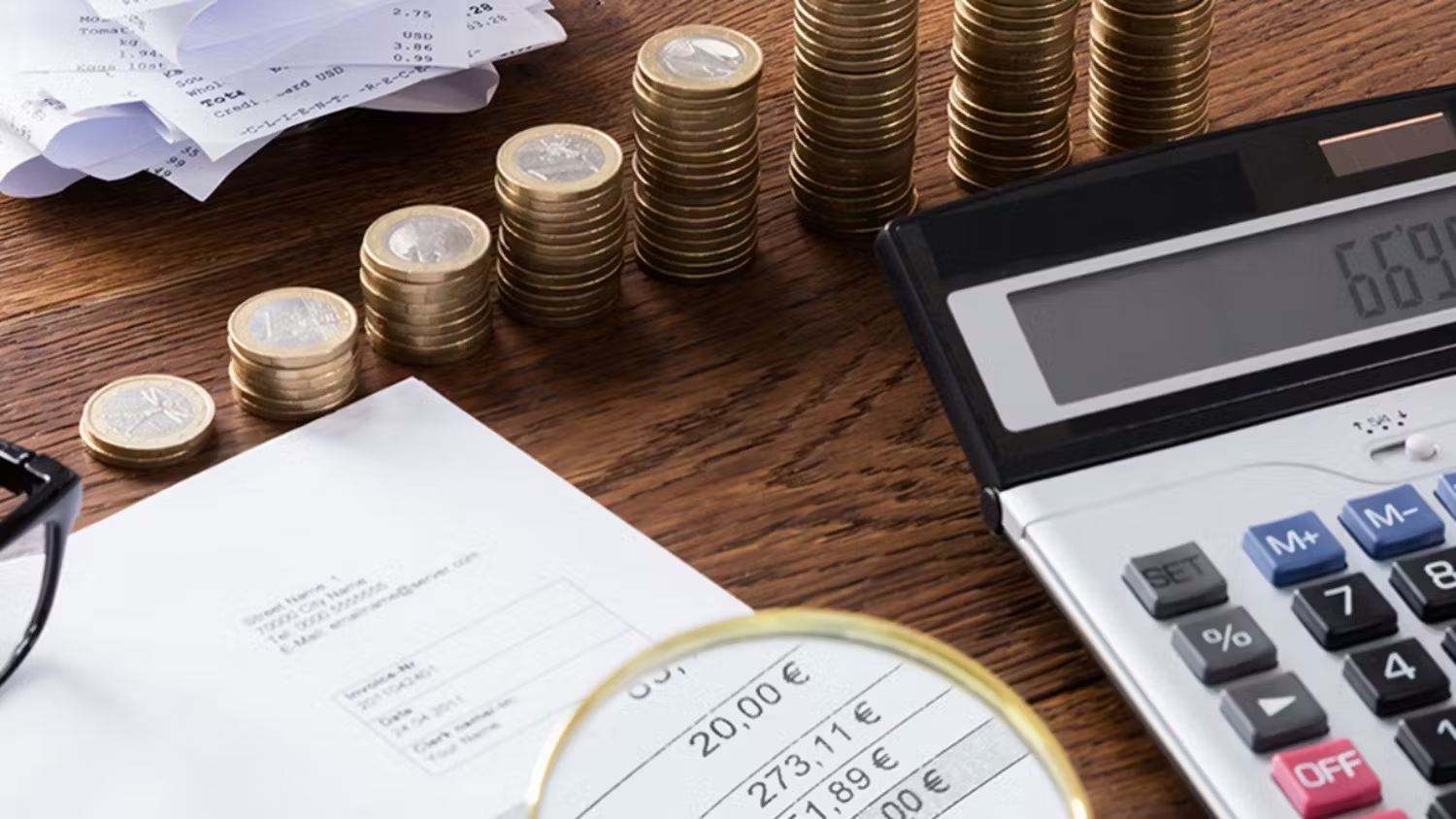 Money being counted via a calculator