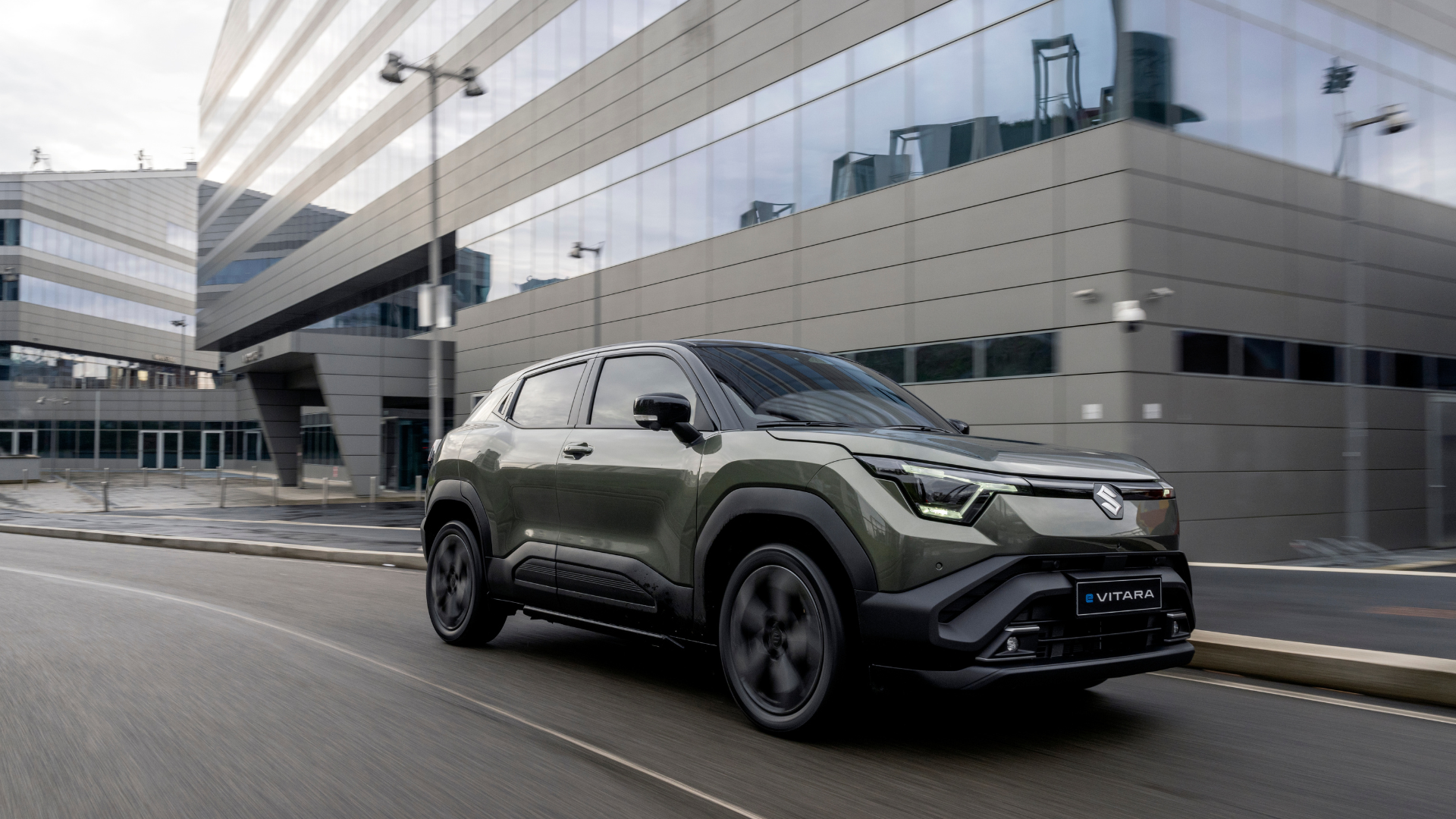 Green Suzuki E-Vitara out in the ciity