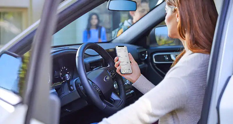 woman looking at the FordPass App
