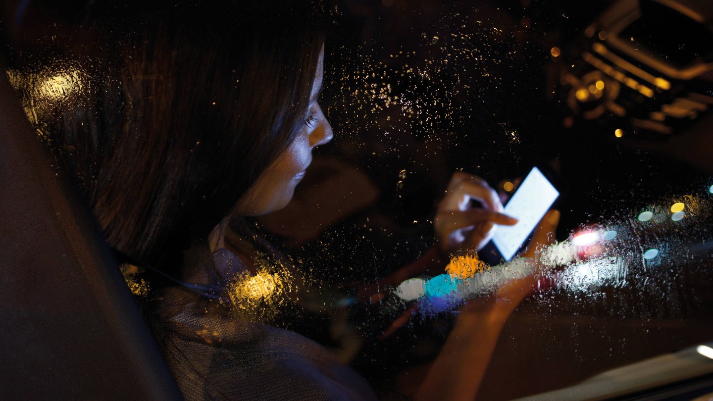 Woman on phone at night