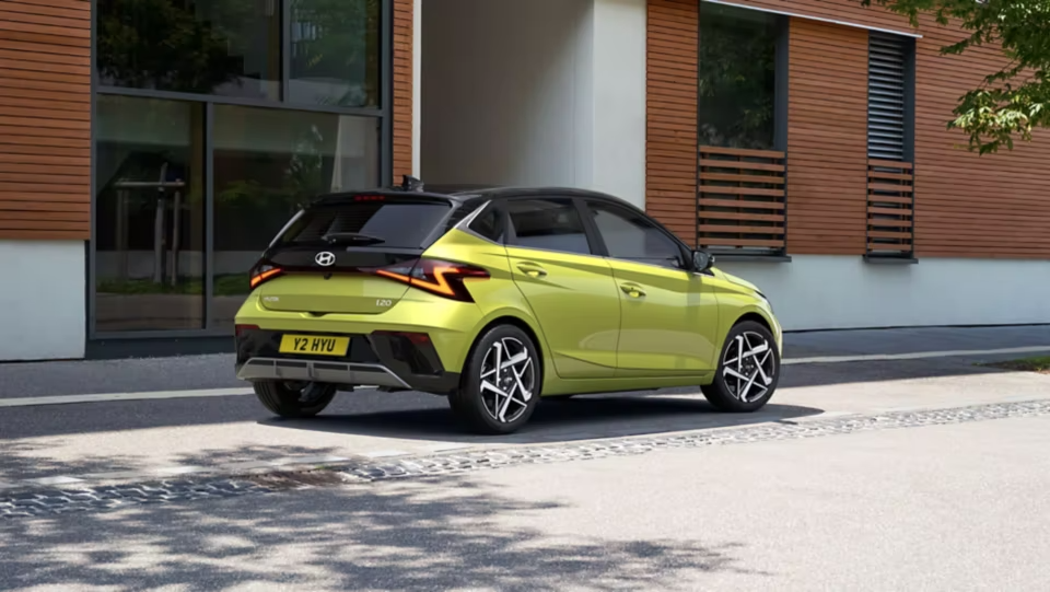 i20 parked in the sun next to a building