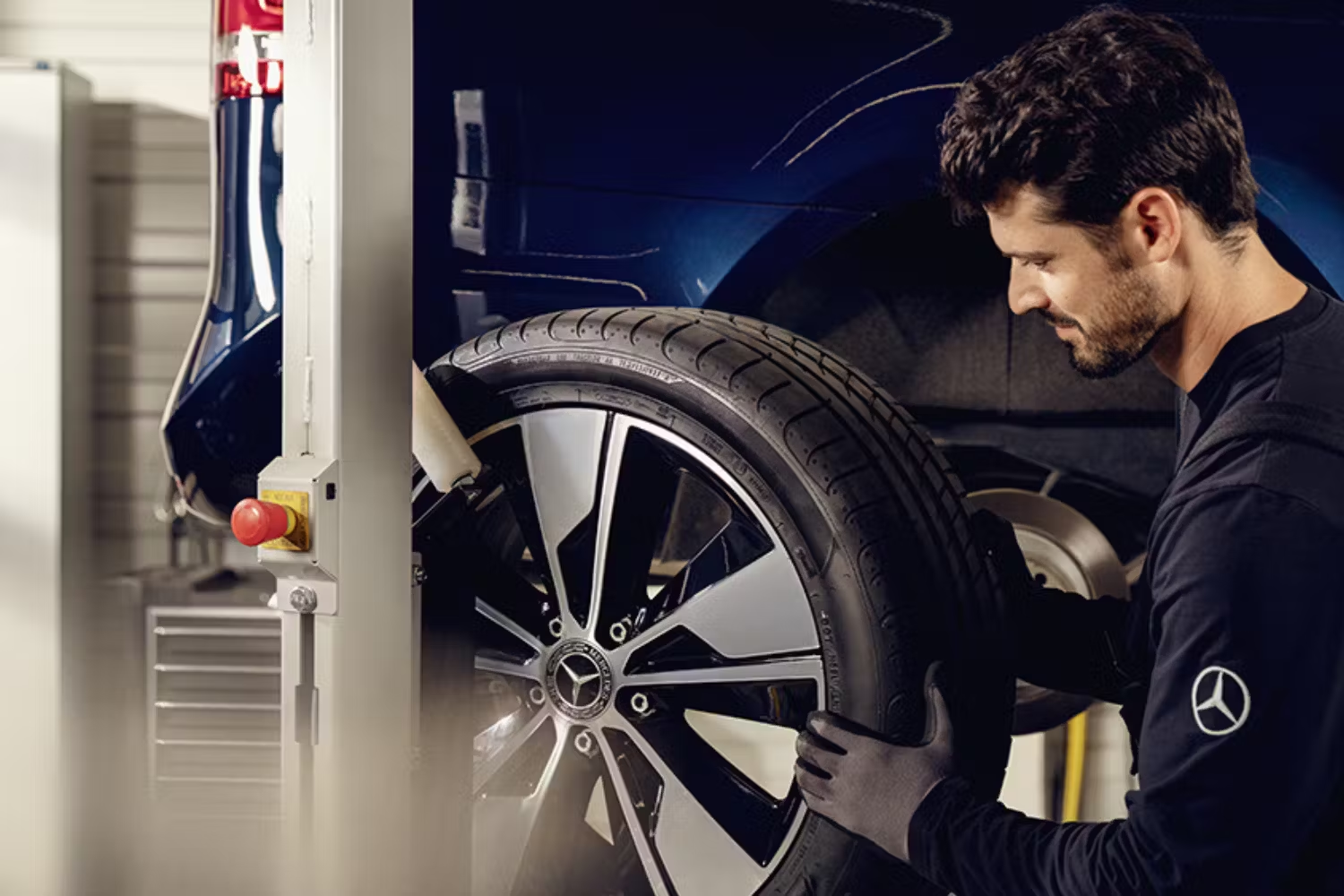 Mercedes-Benz Mechanic Putting on a Tyre