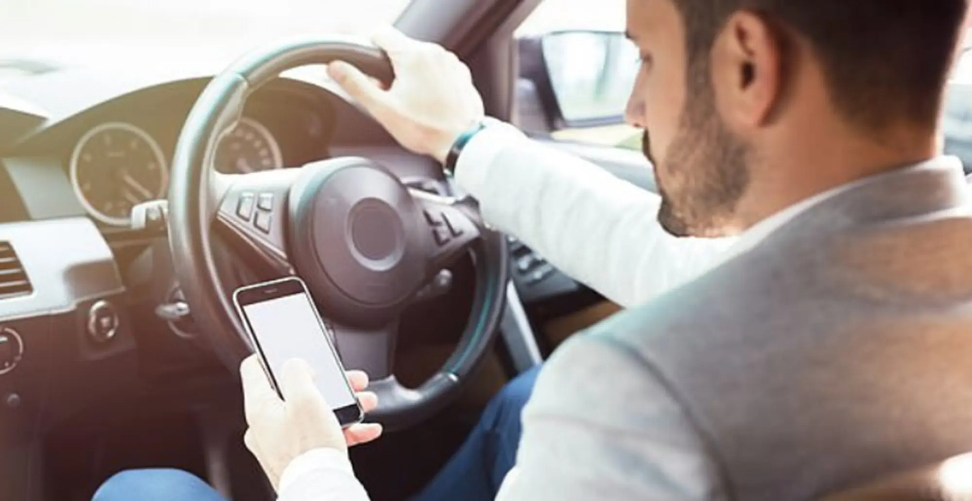 WHAT'S LEGAL WHEN IT COMES TO USING YOUR MOBILE PHONE WHILE DRIVING