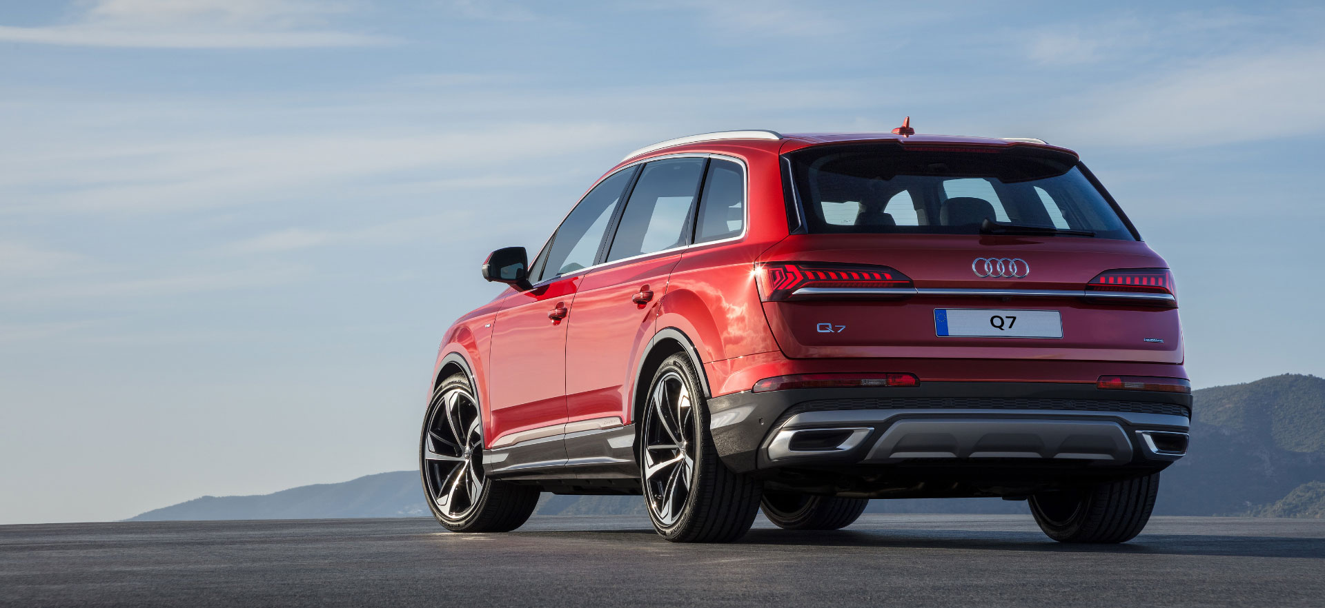 Red Audi Q7 Rear Side View