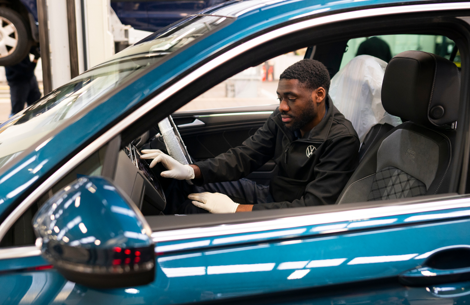 Volkswagen Mechanic Servicing Car