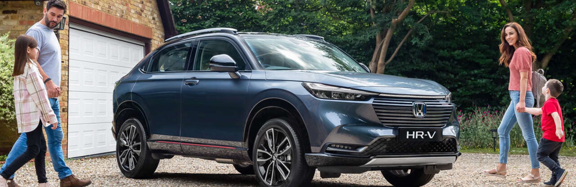 Family walking towards honda suv