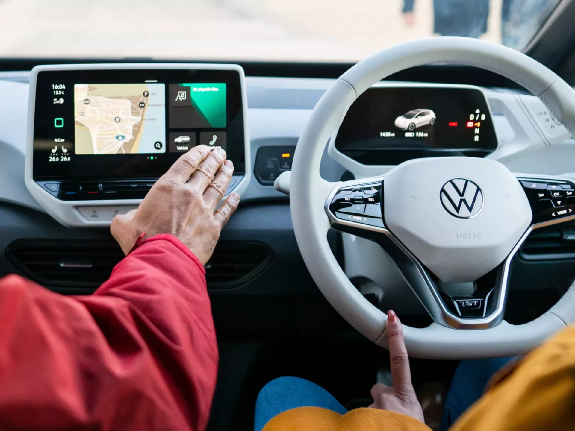 Volkswagen ID.3 Infotainment system and steering wheel. Navigation being set up on infotainment system
