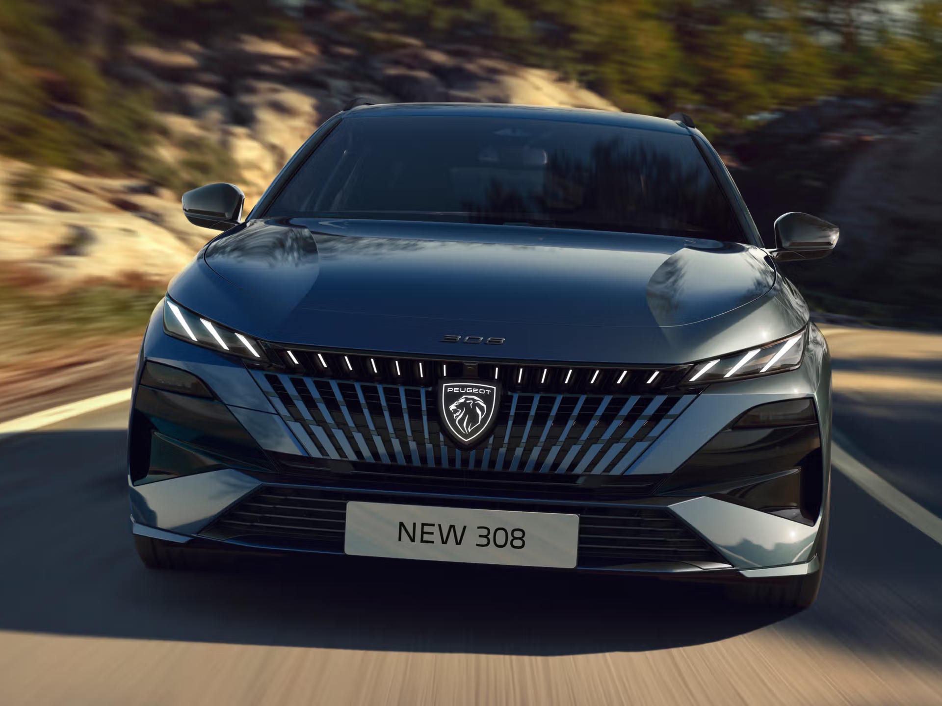 Front-on view of the Peugeot 308 showcasing its bold grille design, LED lighting signature and dynamic styling.