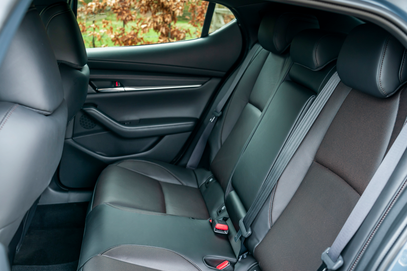 The rear seats inside a new Mazda3 car