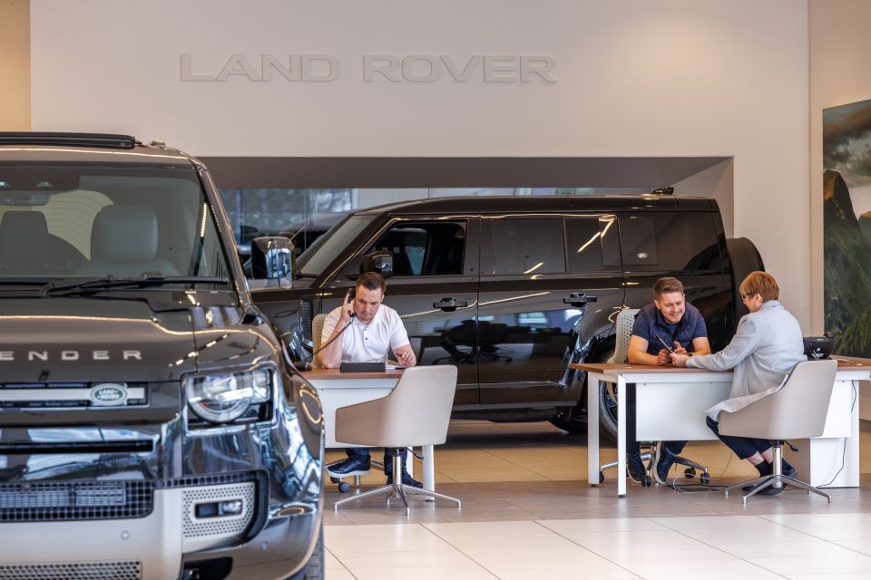 People in Land Rover Showroom