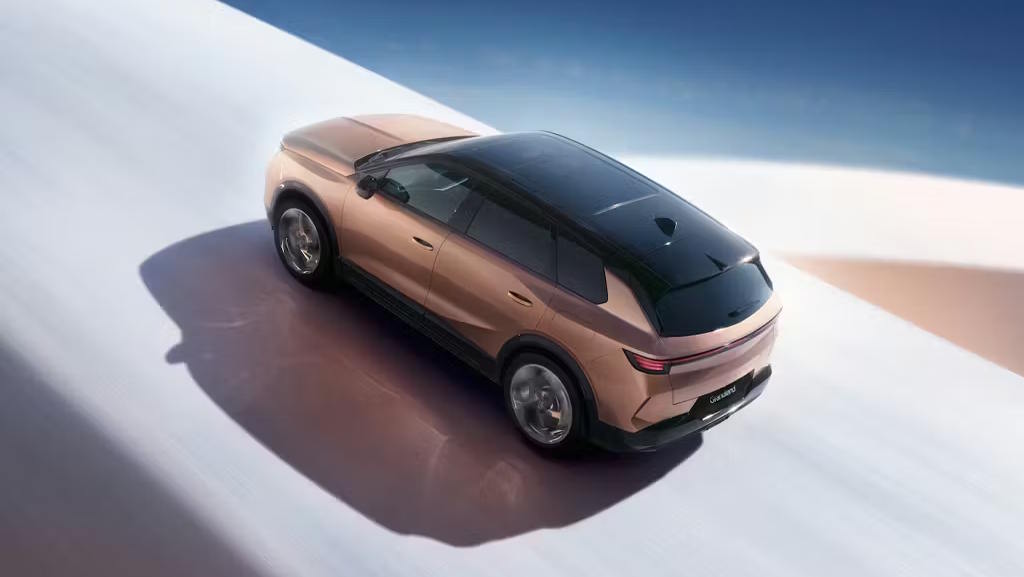 Bronze Vauxhall Grandland shown from above in a minimalist studio setting.