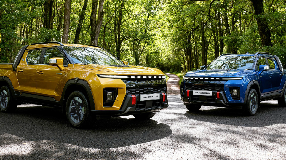 Blazing Gold and Marine Blue KGM Musso EVs in forest