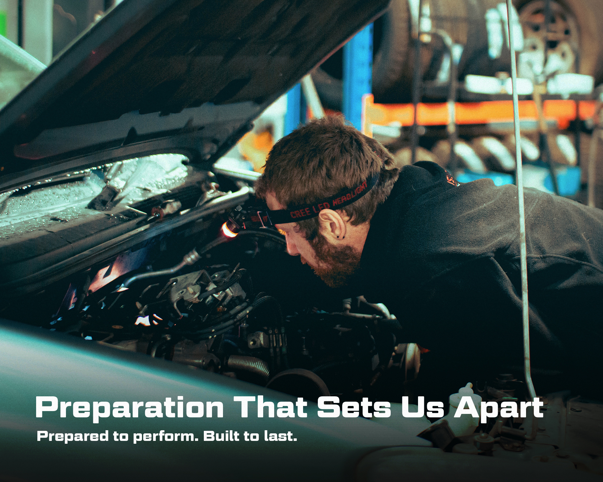 mechanic in an engine bay. Overlaid text reading "Preparation That Sets Us Apart. Prepared to perform. Built to last."